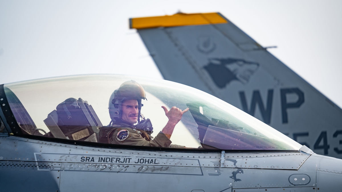 Maj. Rex Anderson, 8th Fighter Wing weapons officer, performs a gesture of squadron pride before departing for a routine flight