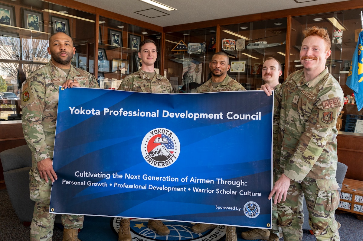Members of the Yokota Professional Development Council (YPDC) pose for a photo inside of the Professional Development Center at Yokota Air Base.