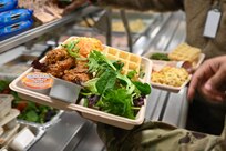 A member of the District of Columbia National Guard is served lunch at Joint Base Anacostia-Bolling, Feb. 3, 2024.  March marks National Nutrition Month, a time when individuals across the nation are encouraged to focus on making more informed food choices and developing healthier eating and physical activity habits.