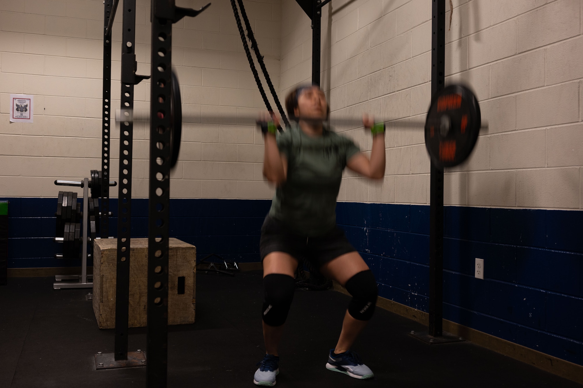 U.S. Air Force Tech. Sgt. Carolina Rodriquez, 512th Airlift Wing loadmaster, performs a thruster during a CrossFit class at Dover Air Force Base, Delaware, March 14, 2024. The Dover AFB Fitness Center CrossFit class is an ongoing program open to all active duty, reserve, spouses and Department of Defense card holders. (U.S. Air Force photo by Airman 1st Class Dieondiere Jefferies)