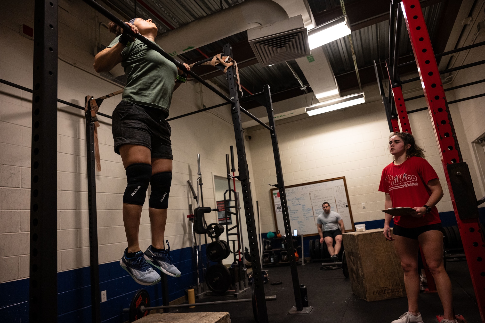 U.S. Air Force Tech. Sgt. Carolina Rodriquez, 512th Airlift Wing loadmaster, performs a pull-up during a CrossFit class at Dover Air Force Base, Delaware, March 14, 2024. The Dover AFB Fitness Center CrossFit class is an ongoing program open to all active duty, reserve, spouses and Department of Defense card holders. (U.S. Air Force photo by Airman 1st Class Dieondiere Jefferies)