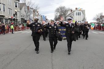 Sailors from USS Truxtun (DDG 103) walk in the famous South Boston St. Patrick's Day/ Evacuation Day parade.