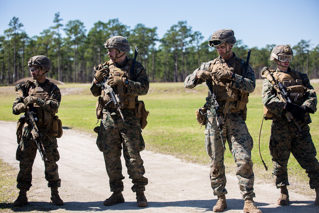 U.S. Marines with 4th Light Armored Reconnaissance Battalion, 4th Marine Division (MARDIV), Marine Forces Reserve, stand by to conduct a live fire event as part of the 4th MARDIV Rifle Squad Competition on Marine Corps Base (MCB) Camp Lejeune, North Carolina, March 10, 2024. The three-day event tested the Marines across a variety of infantry skills to determine the most combat effective rifle squad within the 4th MARDIV. MCB Camp Lejeune training facilities allow warfighters to be ready today and prepare for tomorrow’s fight. (U.S. Marine Corps Photo by Lance Cpl. Daniela Chicas Torres)