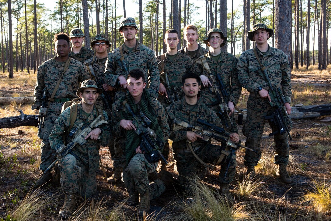 U.S. Marines with 4th Light Armored Reconnaissance Battalion, 4th Marine Division (MARDIV), Marine Forces Reserve, pose for a photo during the 4th MARDIV Rifle Squad Competition on Marine Corps Base (MCB) Camp Lejeune, North Carolina, March 10, 2024. The three-day event tested the Marines across a variety of infantry skills to determine the most combat effective rifle squad within the 4th MARDIV. MCB Camp Lejeune training facilities allow warfighters to be ready today and prepare for tomorrow’s fight. (U.S. Marine Corps Photo by Lance Cpl. Daniela Chicas Torres)
