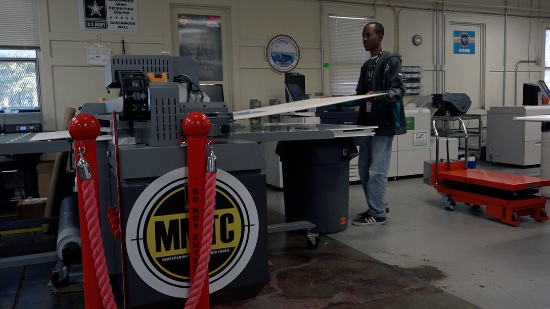 Man printing large poster board