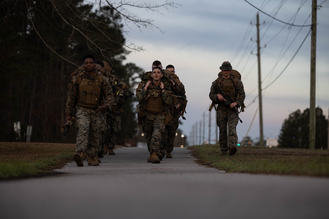 U.S. Marines with 4th Marine Division (MARDIV), Marine Forces Reserve, conduct a timed movement during the 4th MARDIV Rifle Squad Competition on Marine Corps Base (MCB) Camp Lejeune, North Carolina, March 8, 2024. The three-day event tested the Marines across a variety of infantry skills to determine the most combat effective rifle squad within the 4th MARDIV. MCB Camp Lejeune training facilities allow warfighters to be ready today and prepare for tomorrow’s fight. (U.S. Marine Corps Photo by Cpl. Antonino Mazzamuto)