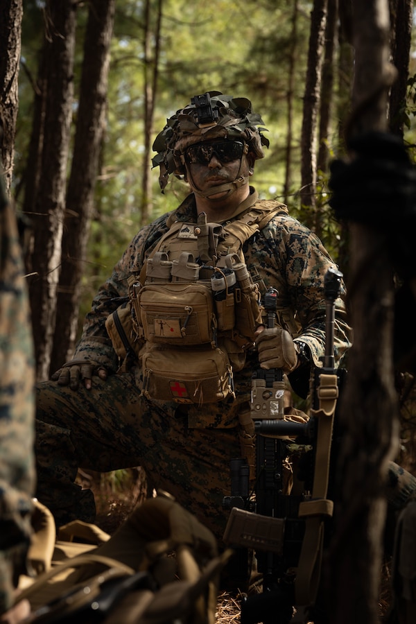 U.S. Marine Corps Cpl. Manuel Lopez, a fire team leader with Golf Company, 2nd Battalion, 23rd Marine Regiment, 4th Marine Division (MARDIV), Marine Forces Reserve, poses for a photo during a patrol as part of the 4th MARDIV Rifle Squad Competition on Marine Corps Base (MCB) Camp Lejeune, North Carolina, March 8, 2024. The three-day event tested the Marines across a variety of infantry skills to determine the most combat effective rifle squad within the 4th MARDIV. MCB Camp Lejeune training facilities allow warfighters to be ready today and prepare for tomorrow’s fight. (U.S. Marine Corps Photo by Cpl. Antonino Mazzamuto)