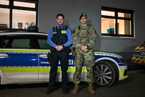 U.S. Air Force Senior Airman Samuel Landreth, 52nd Security Forces Squadron patrolman, and Joshua Smith, Polizeikommissar with the Bitburg Polizei Station, pose for a picture prior to a ride-along at the Bitburg Polizei Station, March 16, 2024.