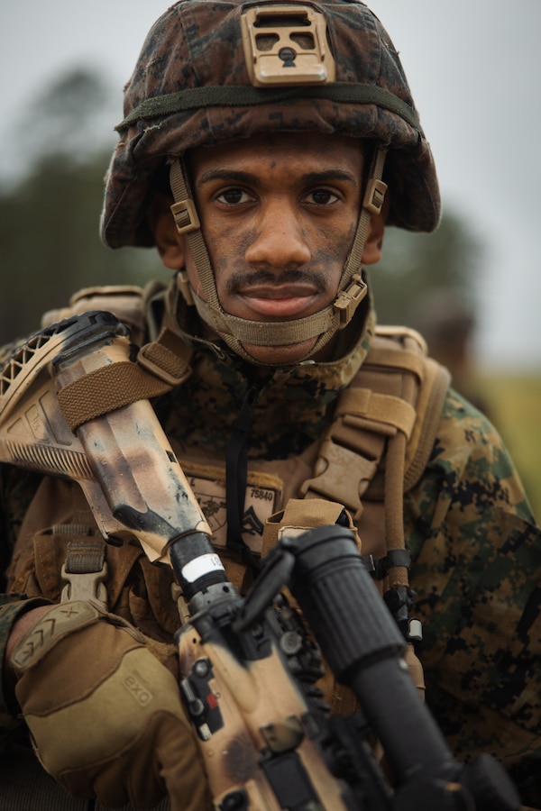 U.S. Marine Corps Cpl. Esmerlin MunozRomero, a squad automatic rifleman with 1st Battalion, 25th Marine Regiment, 4th Marine Division (MARDIV), Marine Forces Reserve, poses for a photo during the 4th MARDIV Rifle Squad Competition on Marine Corps Base (MCB) Camp Lejeune, North Carolina, March 9, 2024. The three-day event tested the Marines across a variety of infantry skills to determine the most combat effective rifle squad within the 4th MARDIV. MCB Camp Lejeune training facilities allow warfighters to be ready today and prepare for tomorrow’s fight. (U.S. Marine Corps Photo by Cpl. Jorge Borjas)