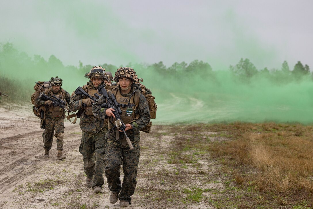 U.S. Marine Corps Cpl. Simon Tumbleson, a squad leader with Golf Company, 2nd Battalion, 23rd Marine Regiment, 4th Marine Division (MARDIV), Marine Forces Reserve, leads his squad out of a defensive position during 4th MARDIV Rifle Squad Competition on Marine Corps Base (MCB) Camp Lejeune, North Carolina, March 9, 2024. The three-day event tested the Marines across a variety of infantry skills to determine the most combat effective rifle squad within the 4th MARDIV. MCB Camp Lejeune training facilities allow warfighters to be ready today and prepare for tomorrow’s fight. (U.S. Marine Corps Photo by Cpl. Antonino Mazzamuto)