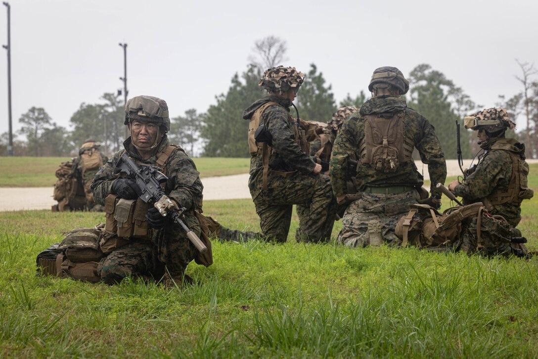 U.S. Navy Hospital Corpsman 3rd Class David Yeh, left, a corpsman with Seal Team 17, participates in the 4th Marine Division (MARDIV) Rifle Squad Competition on Marine Corps Base (MCB) Camp Lejeune, North Carolina, March 8, 2024. The three-day event tested the Marines across a variety of infantry skills to determine the most combat effective rifle squad within the 4th MARDIV. MCB Camp Lejeune training facilities allow warfighters to be ready today and prepare for tomorrow’s fight. (U.S. Marine Corps Photo by Cpl. Antonino Mazzamuto)