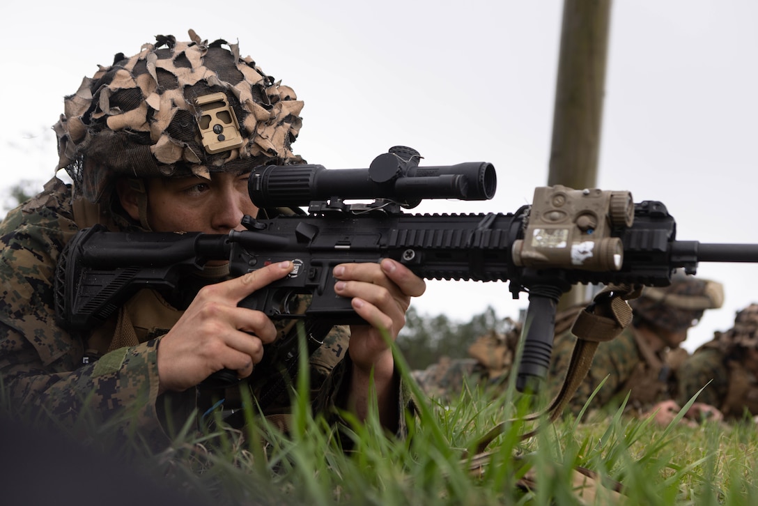 U.S. Marine Corps Cpl. Simon Tumbleson, a squad leader with Golf Company, 2nd Battalion, 23rd Marine Regiment, 4th Marine Division (MARDIV), Marine Forces Reserve, observes an area down range during a team leader’s reconnaissance event as part of the 4th MARDIV Rifle Squad Competition on Marine Corps Base (MCB) Camp Lejeune, North Carolina, March 8, 2024. The three-day event tested the Marines across a variety of infantry skills to determine the most combat effective rifle squad within the 4th MARDIV. MCB Camp Lejeune training facilities allow warfighters to be ready today and prepare for tomorrow’s fight. (U.S. Marine Corps Photo by Cpl. Antonino Mazzamuto)