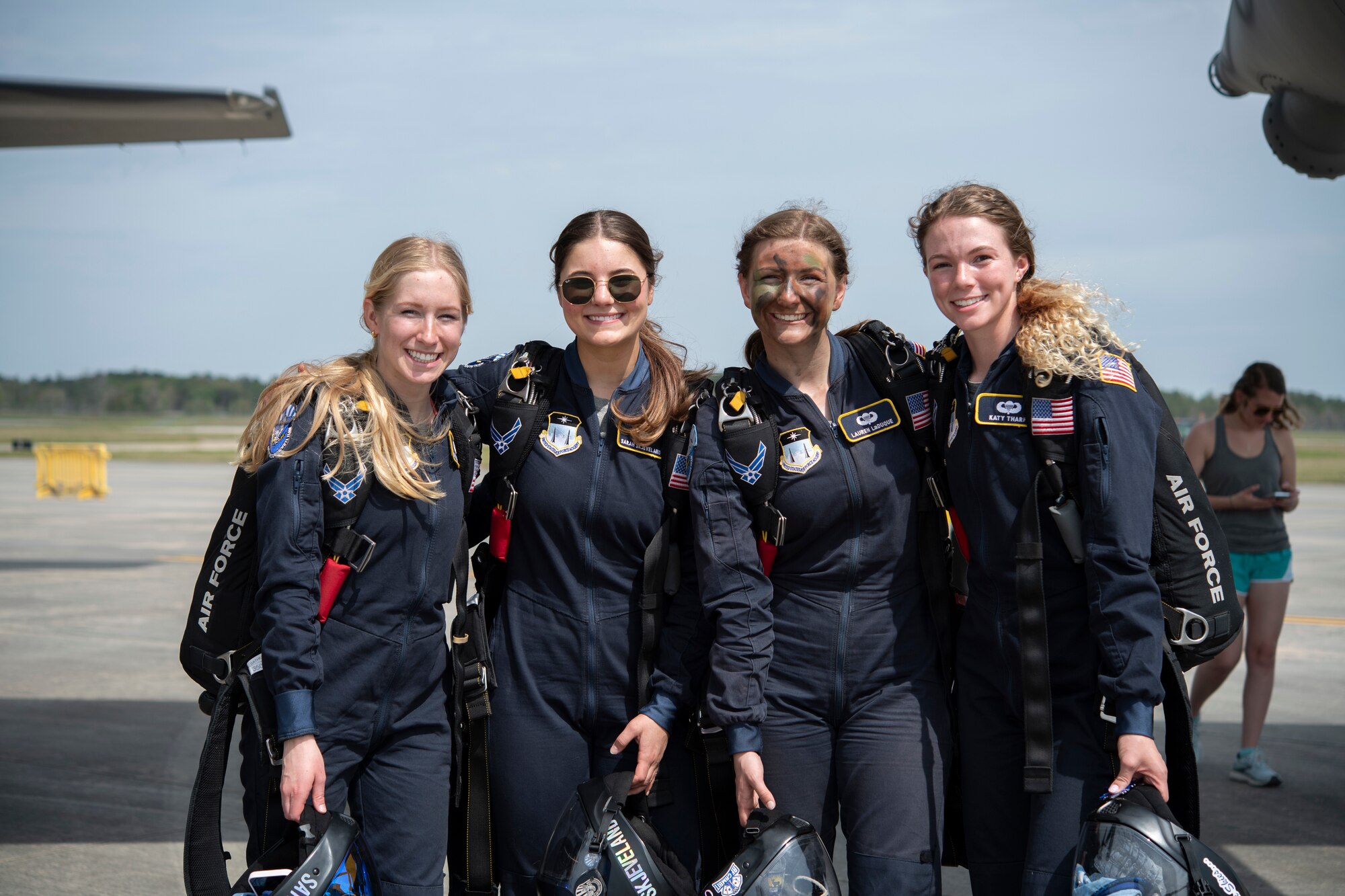 Four females from Wings of Blue Parachute Team pose for a photo