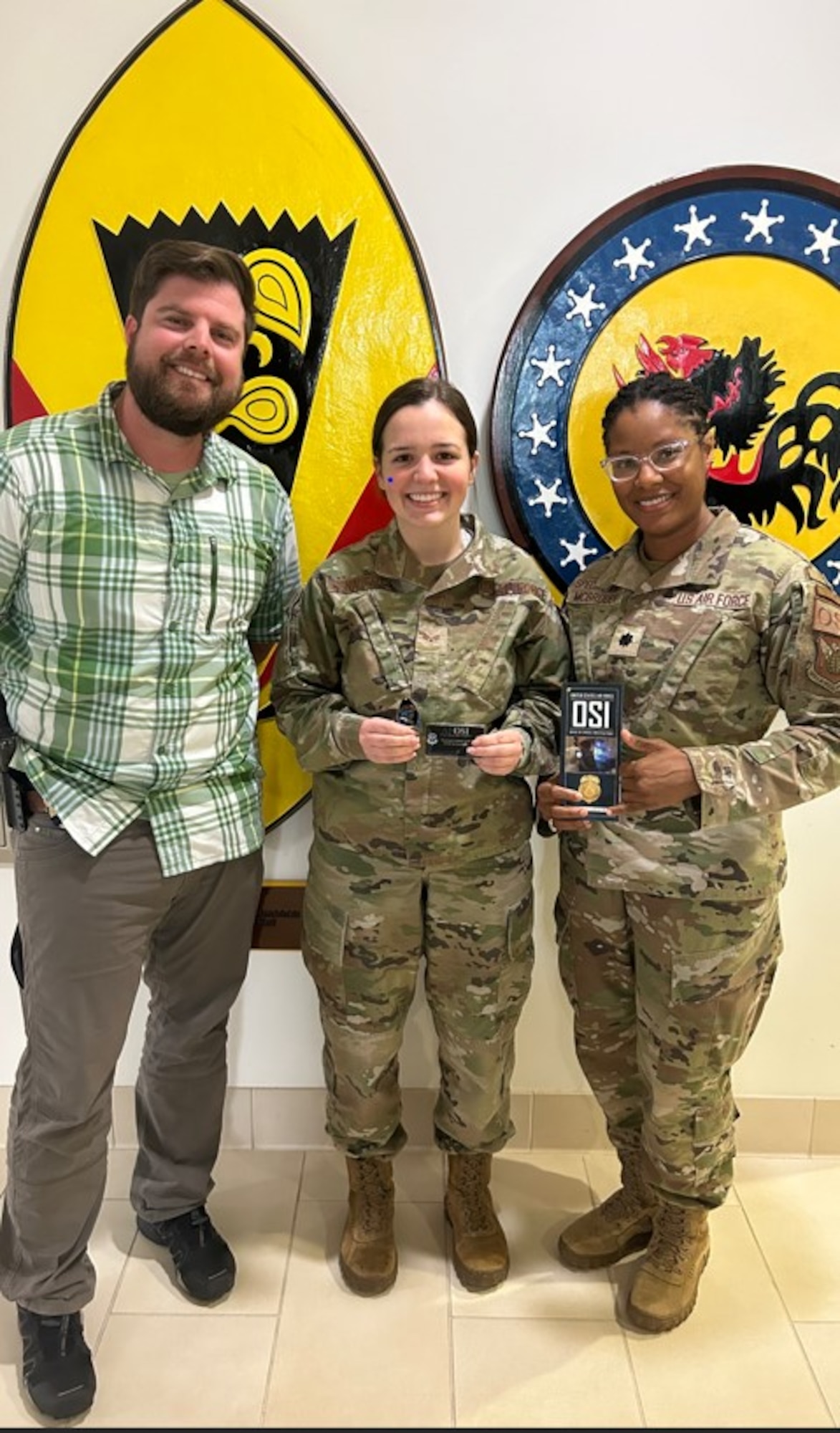 Senior Airman Emily Conaughty was awarded a "golden ticket" by Office of Special Investigations leadership Feb. 13, after she was spotted helping a man near the military gates in Hawaii.