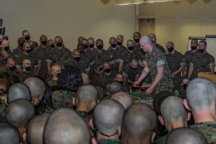 U.S. Marine Corps Sgt. Triston Taylor, a drill instructor with Support Battalion, Recruit Training Regiment, instructs recruits with Fox Company, 2nd Recruit Training Battalion, during the first of three casualty care classes held at Marine Corps Recruit Depot San Diego, California, March 14, 2024. Recruits receive three different periods of instruction on casualty care and the importance of ensuring the appropriate medical care is given at the correct time and place when necessary. (U.S. Marine Corps photo by Sgt. Jesse K. Carter-Powell)