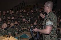 U.S. Marine Corps Sgt. Triston Taylor, a drill instructor with Support Battalion, Recruit Training Regiment, demonstrates to recruits with Fox Company, 2nd Recruit Training Battalion, the use of a tourniquet during the first of three casualty care classes held at Marine Corps Recruit Depot San Diego, California, March 14, 2024. Recruits receive three different periods of instruction on casualty care and the importance of ensuring the appropriate medical care is given at the correct time and place when necessary. (U.S. Marine Corps photo by Sgt. Jesse K. Carter-Powell)