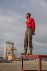 U.S. Marine Corps Staff Sgt. Deandre Lee, a drill instructor with Charlie Company, 1st Recruit Training Battalion, leads warm-up exercises for recruits before they execute a confidence course training event at Marine Corps Recruit Depot San Diego, California, March 11, 2024.  The confidence course is designed to challenge recruits physically and mentally through the execution of obstacles that require strength, balance, and determination. (U.S. Marine Corps photo by Cpl. Sarah M. Grawcock)