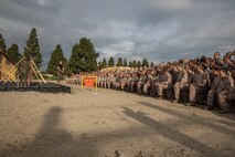 U.S. Marine Corps Staff Sgt. Julian Arroyo, a martial arts instructor with Support Battalion, Recruit Training Regiment, instructs recruits on how to execute obstacles within the confidence course at Marine Corps Recruit Depot San Diego, California, March 11, 2024. The confidence course is designed to challenge recruits physically and mentally through the execution of obstacles that require strength, balance, and determination. (U.S. Marine Corps photo by Cpl. Sarah M. Grawcock)