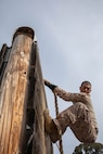 U.S. Marine Corps recruits with Charlie Company, 1st Recruit Training Battalion, traverse across an obstacle during a Marine Corps Confidence Course training event at Marine Corps Recruit Depot San Diego, California, March 11, 2024. The confidence course is designed to challenge recruits physically and mentally through the execution of obstacles that require strength, balance, and determination. (U.S. Marine Corps photo by Cpl. Sarah M. Grawcock)