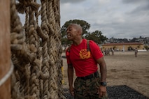 U.S. Marine Corps Staff Sgt. Jonathan Howard, a drill instructor with Charlie Company, 1st Recruit Training Battalion, provides instructions to recruits on the confidence course at Marine Corps Recruit Depot San Diego, California, March 11, 2024. The confidence course is designed to challenge recruits physically and mentally through the execution of obstacles that require strength, balance, and determination. (U.S. Marine Corps photo by Cpl. Sarah M. Grawcock)
