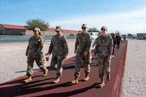 U.S. Air Force Airmen and community members participate in the Women Everywhere Walk at Nellis Air Force Base, Nevada, March 7, 2024.