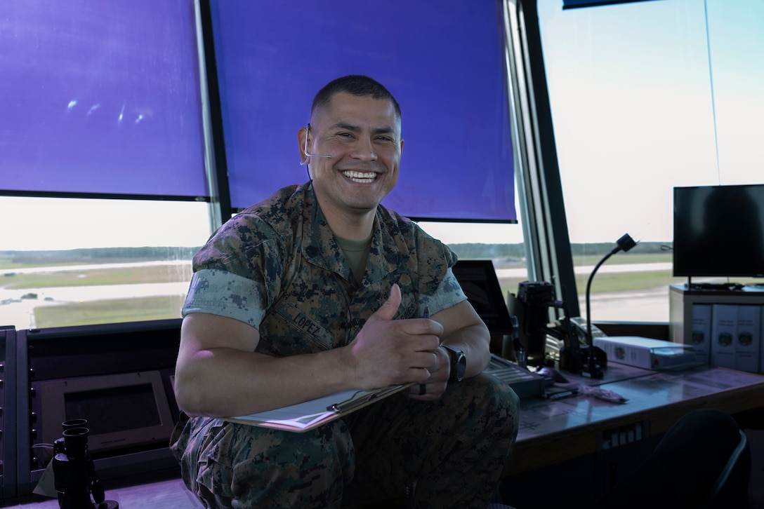 U.S. Marine Corps Staff Sgt. Randal Lopez, an air traffic controller assigned to Headquarters and Headquarters Squadron, Marine Corps Air Station Cherry Point, coordinates with the radar room from the air traffic control tower, MCAS Cherry Point, North Carolina, March 11, 2024. The air traffic control tower is responsible for coordinating all movement within the installation's airspace and airfield. (U.S. Marine Corps photo by Lance Cpl. Lauralle Gavilanes)