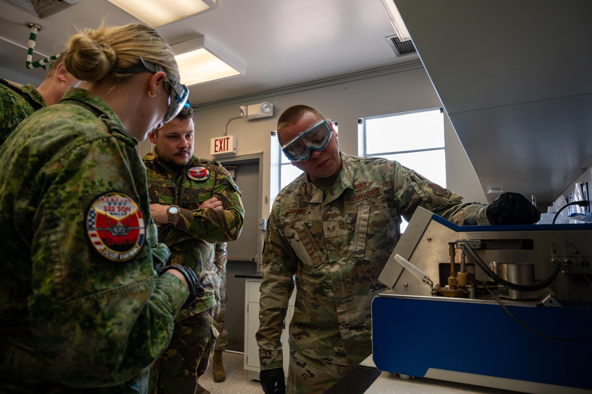 U.S. Air Force Staff Sgt. Thomas Dennis, a Fuels Laboratory Supervisor assigned to the 99th Logistics Readiness Squadron, demonstrates the “flashpoint test” for Royal Netherlands Air Force airmen at Nellis Air Force Base, Nevada, March 11, 2024.