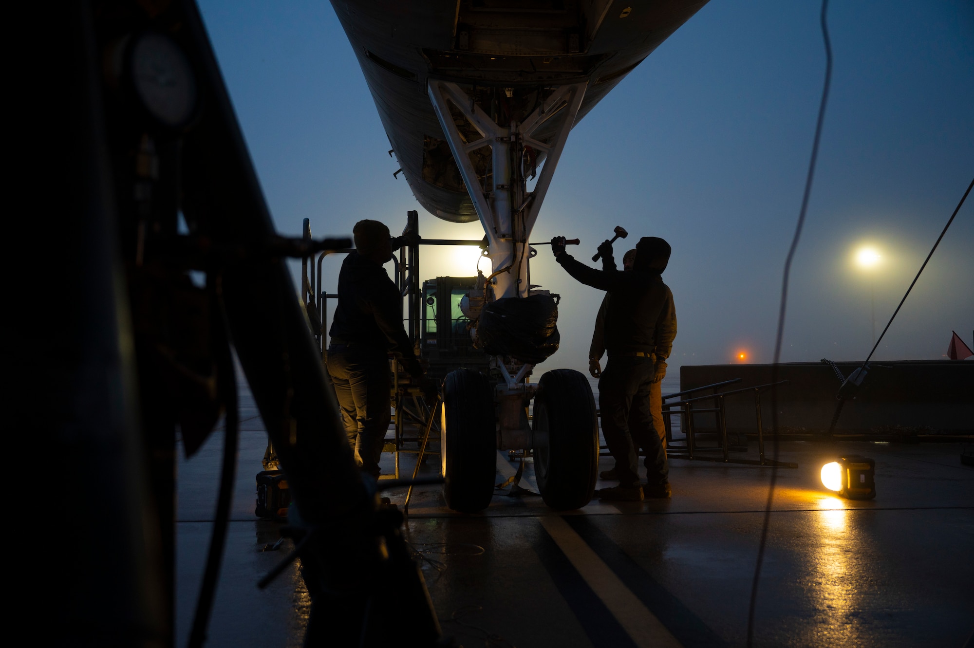 Airmen from the 76th Aircraft Maintenance Group’s Expeditionary Depot Maintenance Flight at Tinker Air Force Base remove the wheels from a B-1B Lancer at Dyess Air Force Base, Texas, Jan. 23, 2024. The aircraft was transported to Wichita, Kansas, for research to improve maintenance processes, reduce repair costs and improve aircraft availability. (U.S. Air Force photo by Airman 1st Class Emma Anderson)