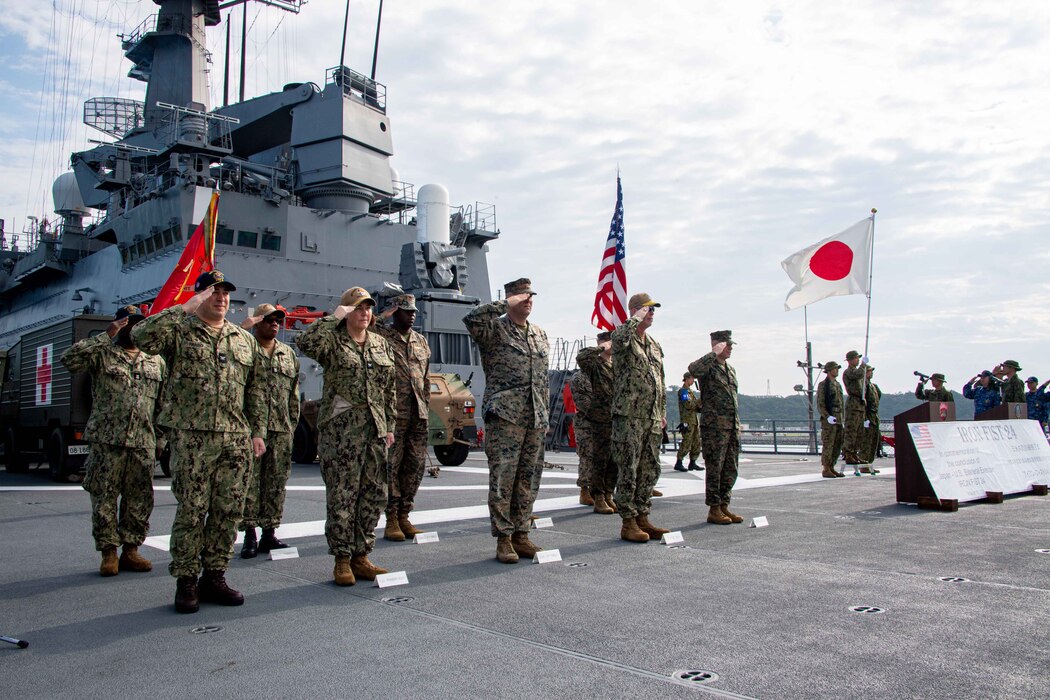 From left to right: Commanding Officer of the forward-deployed amphibious assault carrier, USS America (LHA 6), Capt. Manny Pardo; Commodore of Amphibious Squadron 11, Capt. Kelly Fletcher; Commanding Officer, 31st Marine Expeditionary Unit, Col. Matthew Danner; Commander, Task Force 76/3, Rear Adm. Christopher Stone; and Commanding General of 3rd Marine Expeditionary Brigade, Brig. Gen. Trevor Hall salute during the closing ceremony of Exercise Iron Fist, aboard the Ōsumi-class tank landing ship JS Kunisaki (LST-4003), in Okinawa, Japan, Mar. 17