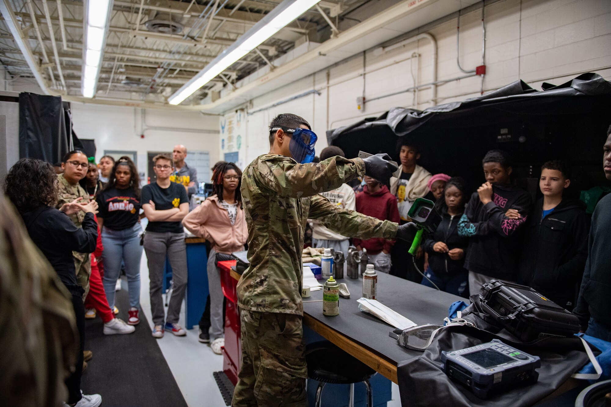 U.S. Air Force Airman 1st Class Ryan Leza, 23rd Maintenance Squadron nondestructive inspection apprentice, gives a demonstration to Valdosta Middle School students at Moody Air Force Base, Georgia, March, 15, 2024. The students toured Moody AFB during Women in Aviation Week. Team Moody’s annual WIA events aim to highlight aviation-related career fields and inspire local youth to consider futures in the Air Force. (U.S. Air Force photo by Senior Airman Courtney Sebastianelli)