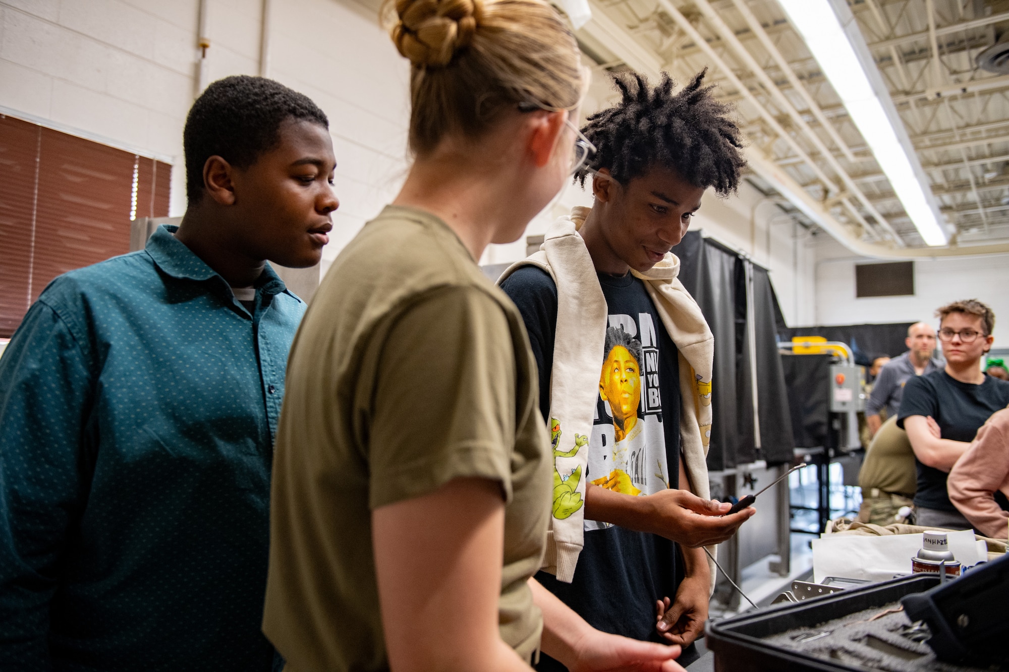 U.S. Air Force Airman 1st Class Aubrey Baird, 23rd Maintenance Squadron nondestructive inspection journeyman, explains how to conduct an equipment ultra sound to Valdosta Middle School students at Moody Air Force Base, Georgia, March 15, 2024. As part of Women in Aviation Week, Moody AFB Airmen gave demonstrations to educate students on their Air Force specialties. Team Moody’s annual WIA events aim to highlight aviation-related career fields and inspire local youth to consider futures in the Air Force.  (U.S. Air Force photo by Senior Airman Courtney Sebastianelli)