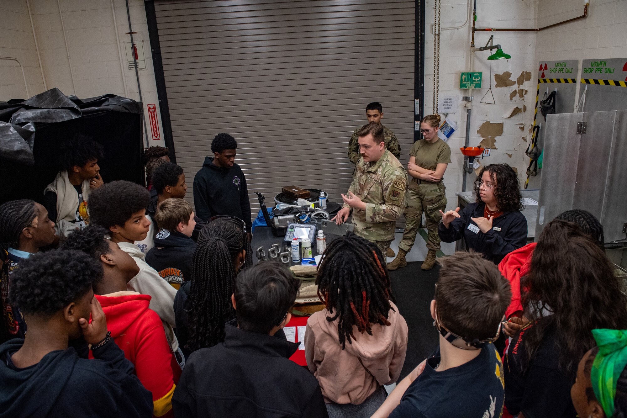 U.S. Air Force Tech. Sgt. Cody Dickerson, 23rd Maintenance Squadron nondestructive inspection supervisor, speaks to Valdosta Middle School students at Moody Air Force Base, Georgia, March 15, 2024. The students visited Moody AFB during Women in Aviation Week to learn about various Air Force specialties in the 23rd Wing and 93rd Air Ground Operations Wing. Team Moody’s annual WIA events aim to highlight aviation-related career fields and inspire local youth to consider futures in the Air Force. (U.S. Air Force photo by Senior Airman Courtney Sebastianelli)
