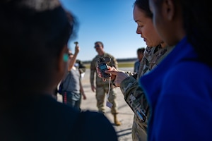 U.S. Air Force Senior Airman Maria Shank, 23rd Operations Support Squadron weather journeyman demonstrates proper use of a kestrel to Lanier Middle School students at Moody Air Force Base, Georgia, March 12, 2024. The students toured Moody AFB during the inaugural Junior Ranger Program field trip. (U.S. Air Force photo by Senior Airman Courtney Sebastianelli)