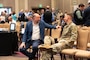 Attendees of the Sacramento District annual Business Opportunity Open House (BOOH) speak with each other before the presentation begins in Sacramento, California on March 5, 2024.