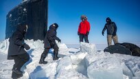 240316-N-EI510-1734 BEAUFORT SEA, Arctic Circle (March 16, 2024) – Chief of Naval Operations Adm. Lisa Franchetti embarks the Virginia-class fast-attack submarine USS Indiana (SSN 789) during Operation Ice Camp (ICE CAMP) 2024. ICE CAMP is a three-week operation that allows the Navy to assess its operational readiness in the Arctic, increase experience in the region, advance understanding of the Arctic environment, and continue to develop relationships with other services, allies, and partner organizations. (U.S. Navy photo by Mass Communication Specialist 1st class Scott Barnes)