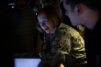 240316-N-EI510-2422 BEAUFORT SEA, Arctic Circle (March 16, 2024) – Chief of Naval Operations Adm. Lisa Franchetti speaks with Sailors assigned to the Virginia-class fast-attack submarine USS Indiana (SSN 789) aboard the Indiana during Operation Ice Camp (ICE CAMP) 2024. ICE CAMP is a three-week operation that allows the Navy to assess its operational readiness in the Arctic, increase experience in the region, advance understanding of the Arctic environment, and continue to develop relationships with other services, allies, and partner organizations. (U.S. Navy photo by Mass Communication Specialist 1st class Scott Barnes)