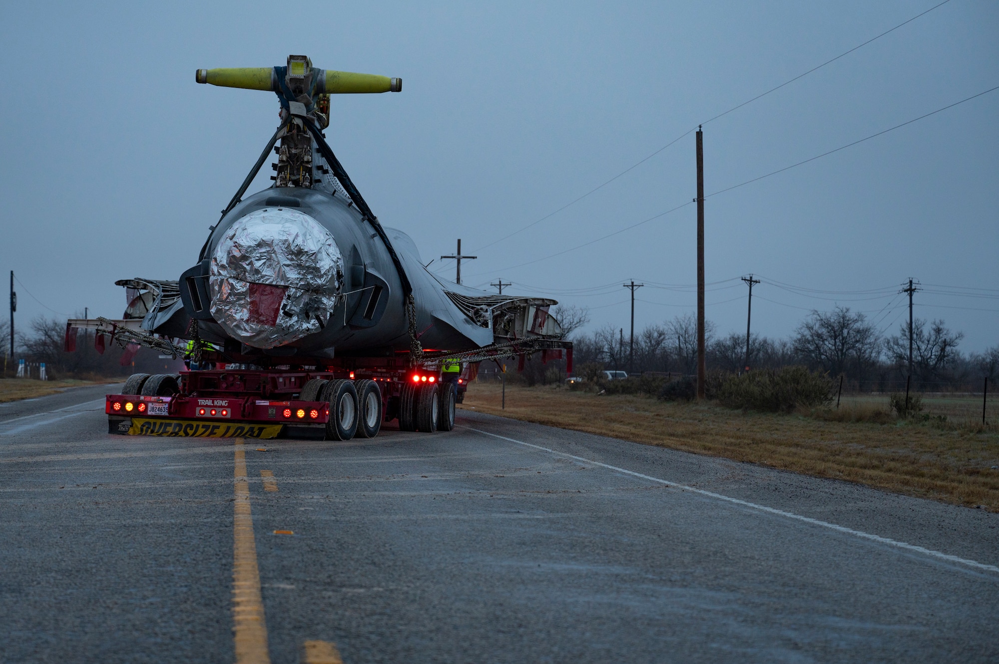 A B-1B Lancer from the 498th Bomb Group is transported from Dyess Air Force Base, Texas, Jan. 24, 2024. Later this year, a regenerated aircraft from Davis-Monthan AFB will be replacing the aircraft. (U.S. Air Force photo by Airman 1st Class Emma Anderson)
