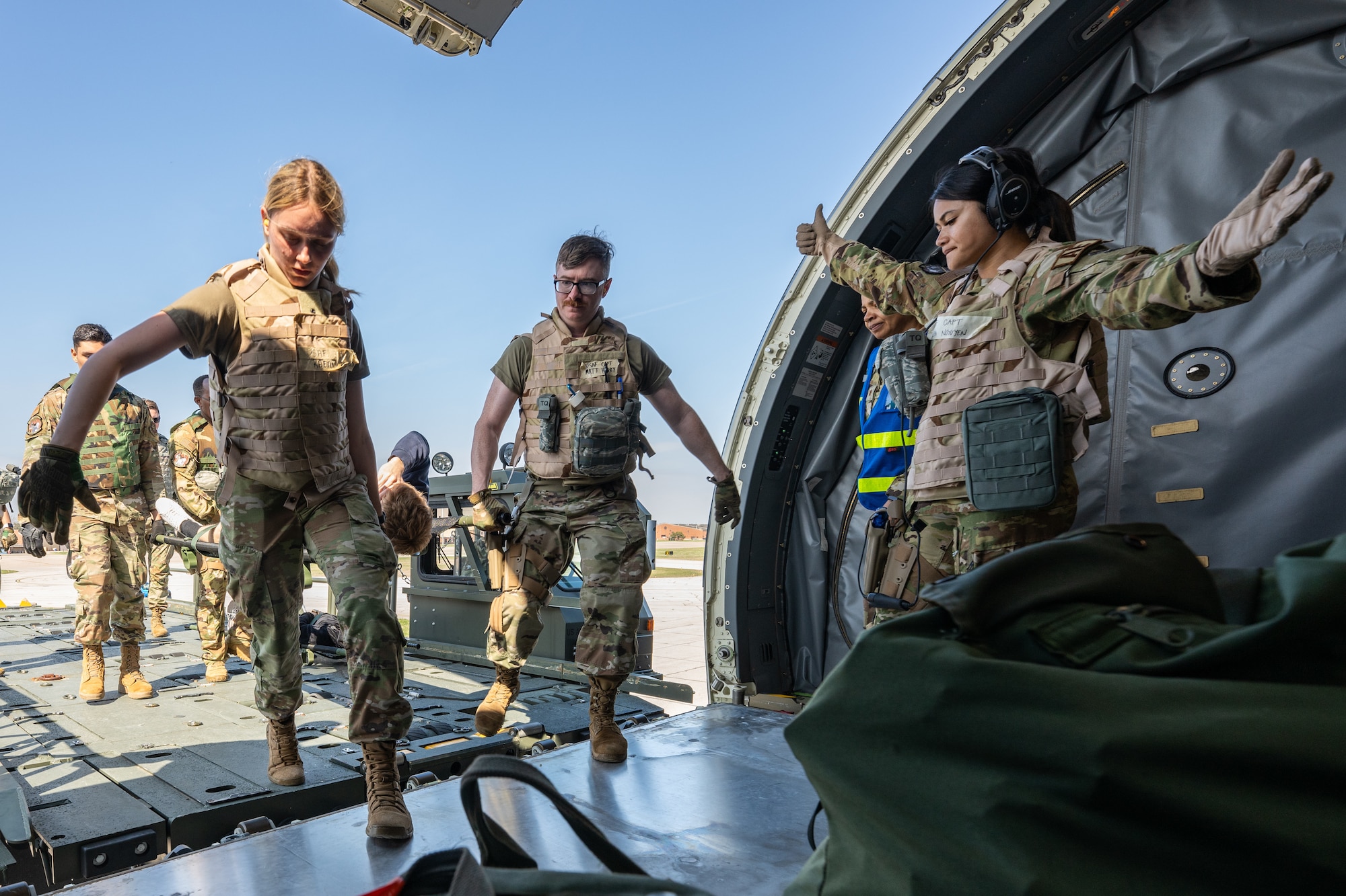 A simulated wounded Airman is loaded onto a Boeing KC-46 Pegasus plane
