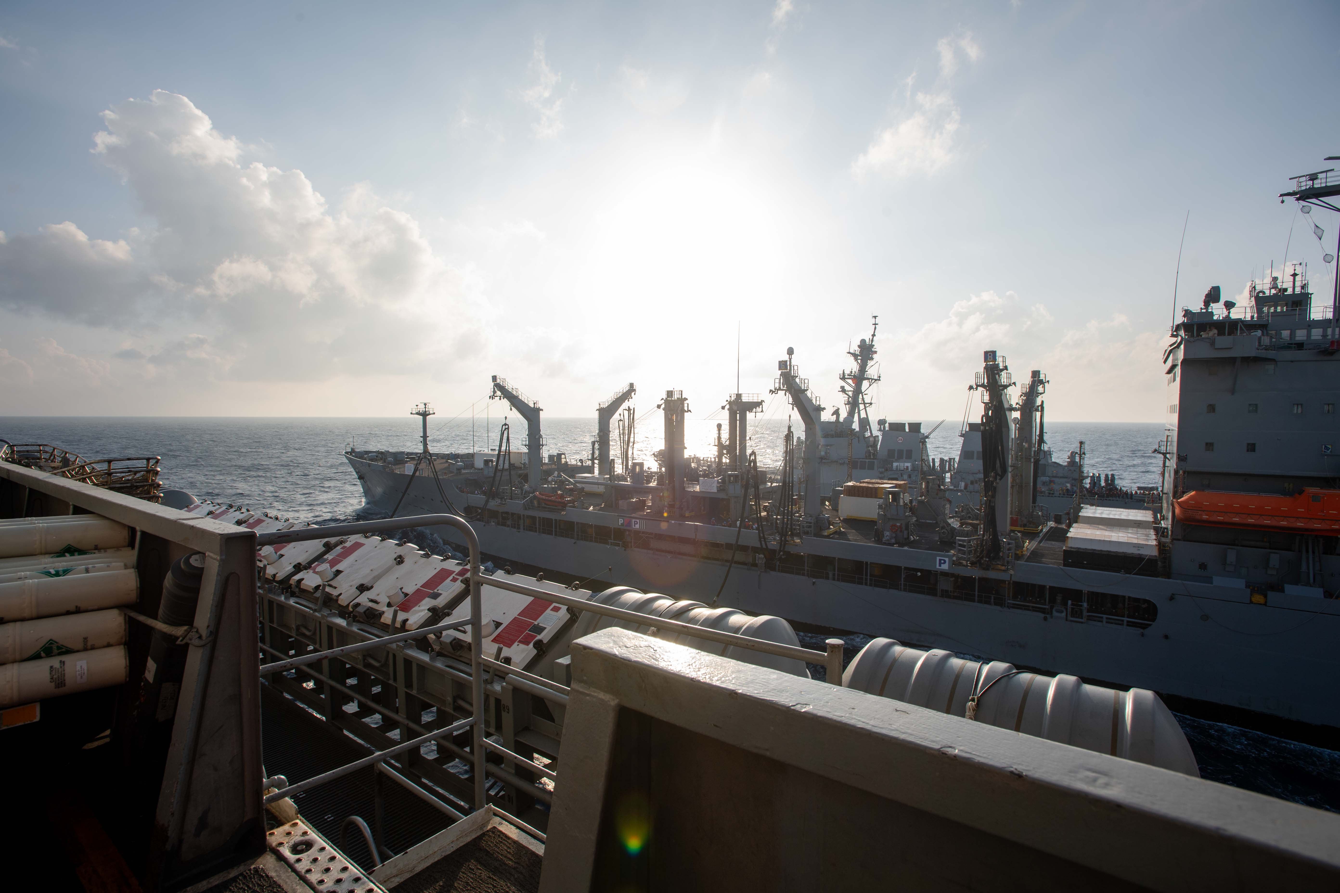 he Military Sealift Command fleet replenishment oiler USNS Yukon (T-AO 202), center, gives fuel to the Nimitz-class aircraft carrier USS Theodore Roosevelt (CVN 71)during a replenishment-at-sea