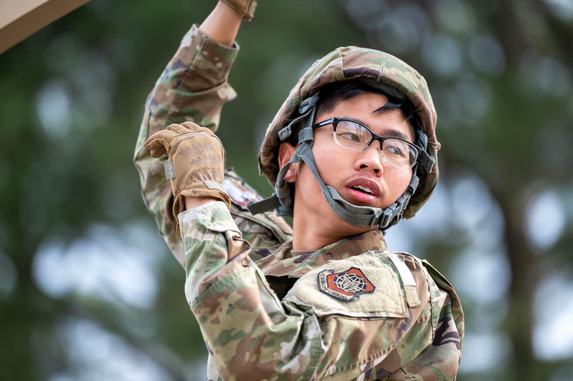 An Airman assists in building a tent.