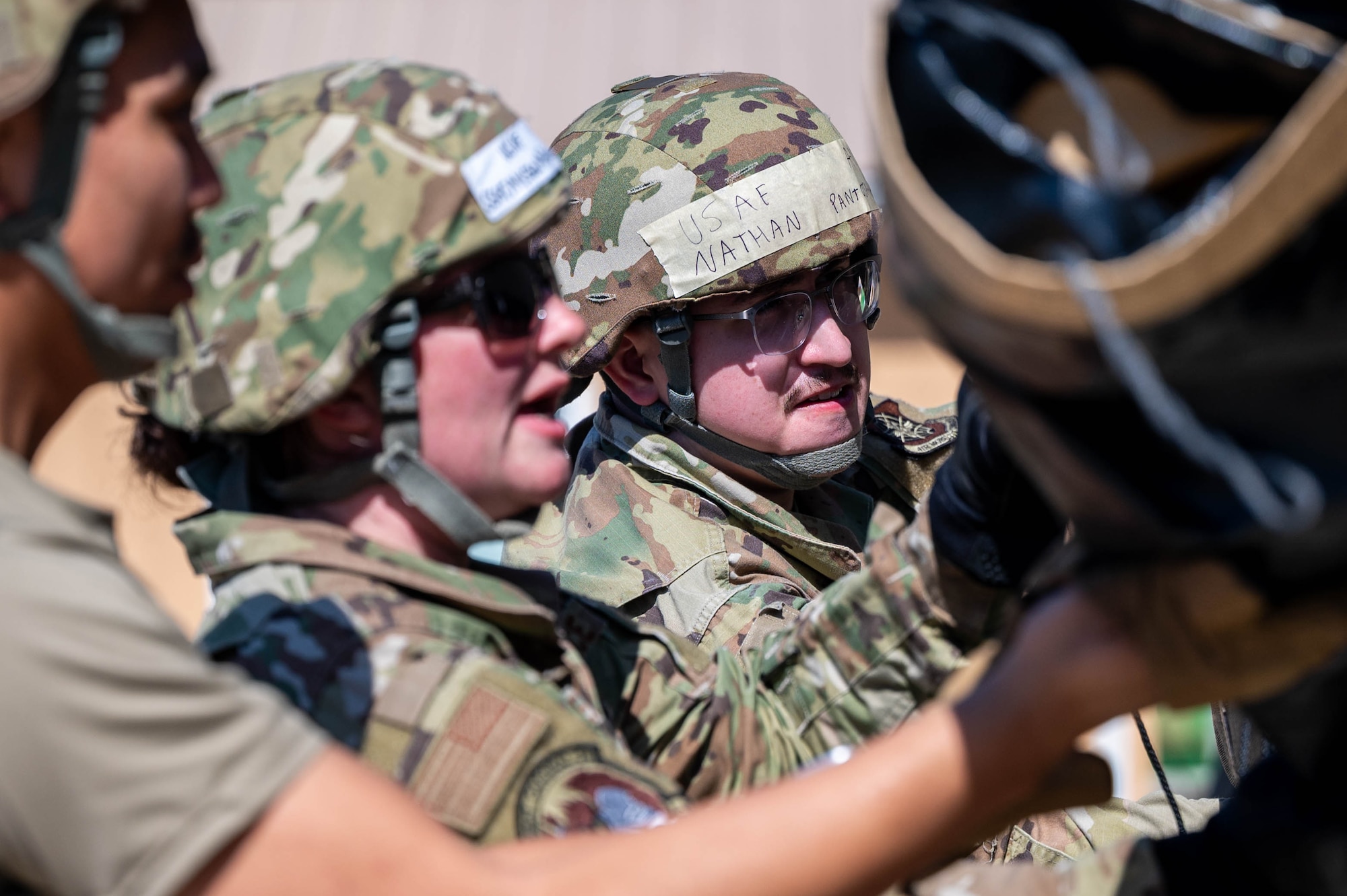Airmen roll down a tent flap during Combat Cardinal 2024.