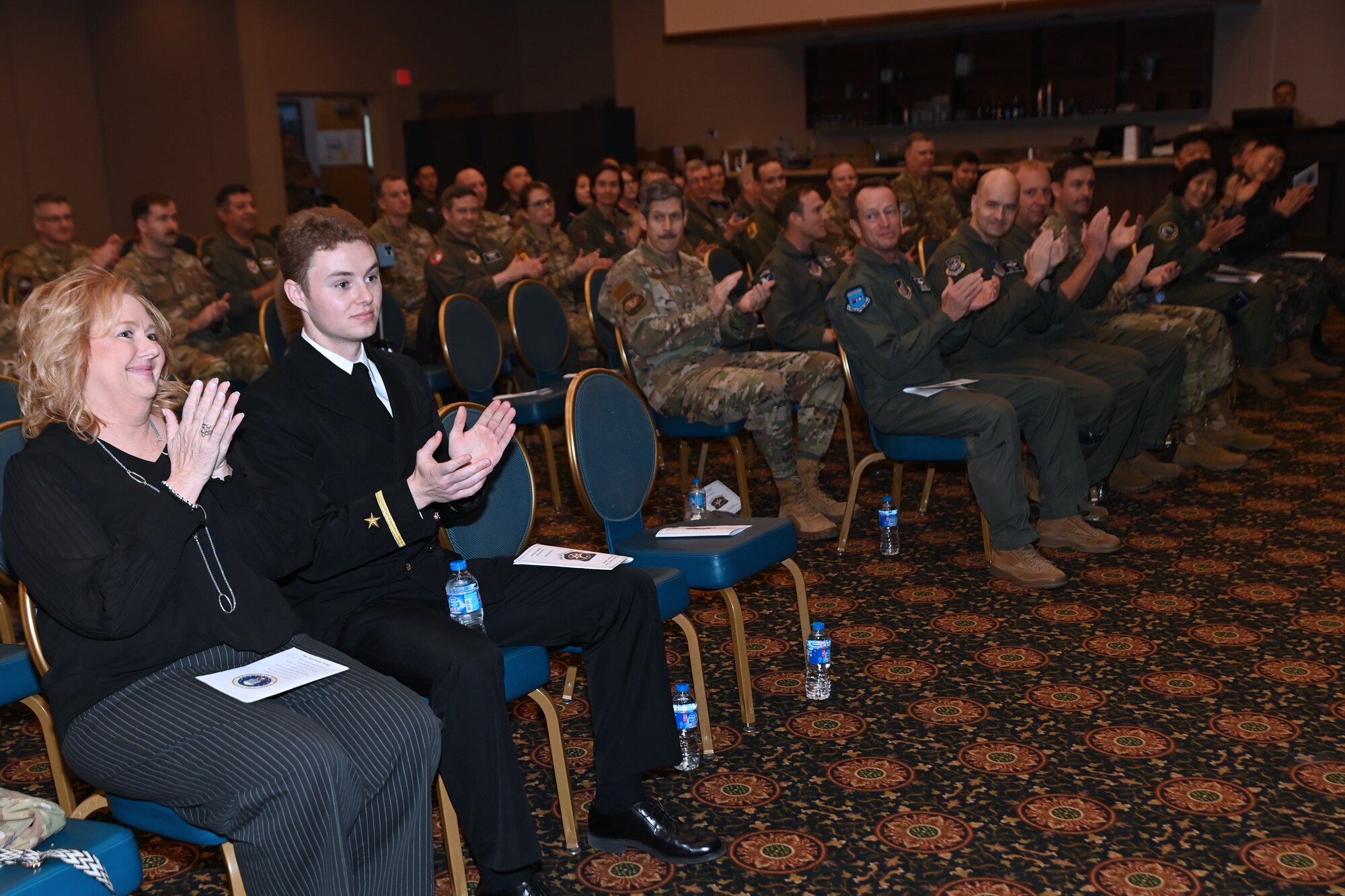 Attendees applaud during the retirement ceremony of Maj. Gen. Daniel Heires, Mobilization Assistant to the Commander, Air Component Command, United Nations Command; Commander, Air Component Command, Combined Forces Command; and Commander, Seventh Air Force, at Osan Air Base, Republic of Korea, March 15, 2024.