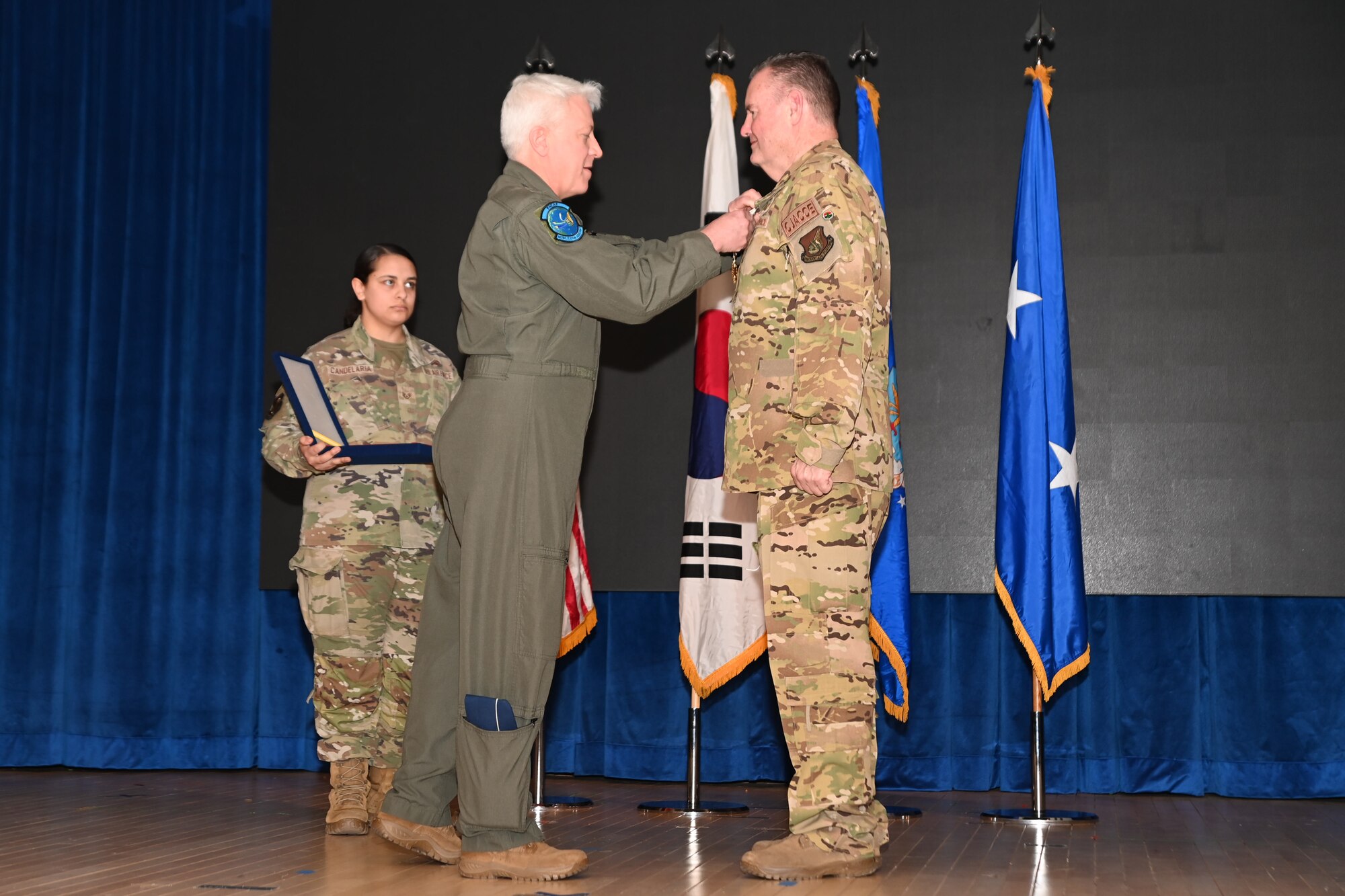 Maj. Gen. Erich Novak, Mobilization Assistant to the Commander, Pacific Air Forces, Joint Base Pearl Harbor-Hickam, Hawaii, left, presents the Distinguished Service Medal to Maj. Gen. Daniel Heires, Mobilization Assistant to the Commander, Air Component Command, United Nations Command; Commander, Air Component Command, Combined Forces Command; and Commander, 7th Air Force, right, during General Heires’ retirement ceremony at Osan Air Base, Republic of Korea, March 15, 2024.