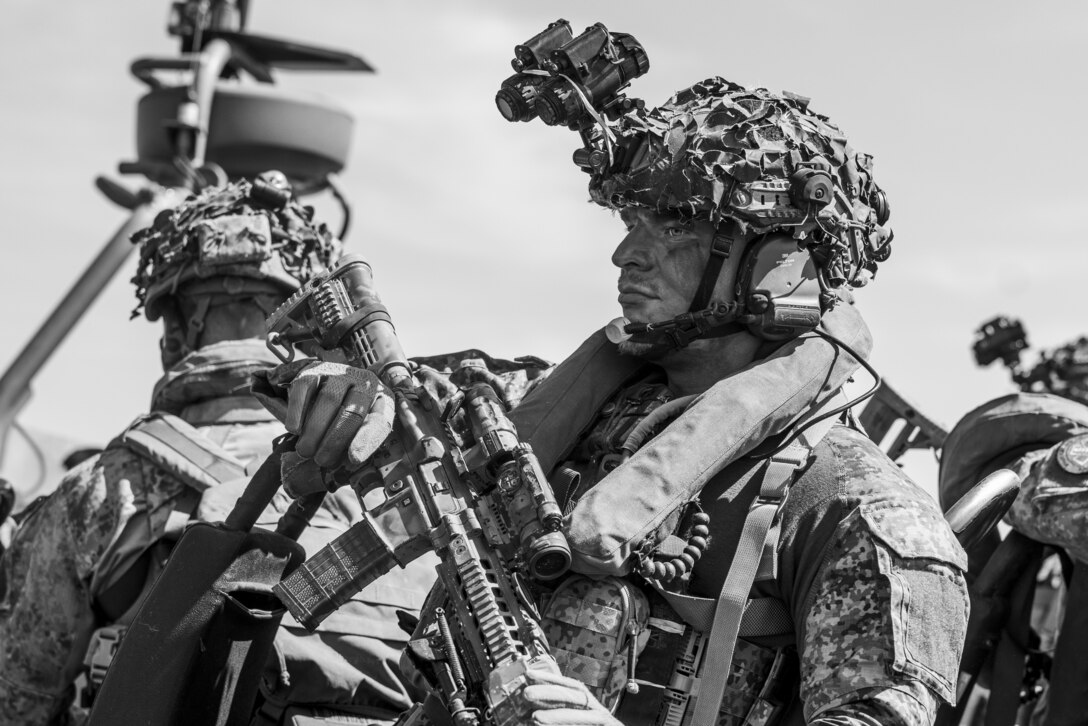 A Dutch Marine with Marine Squadron Carib prepares to conduct simulated amphibious assault training event during Exercise Caribbean Urban Warrior on Camp Lejeune, North Carolina, March 13, 2024. Exercise Caribbean Urban Warrior is a bilateral training evolution designed to increase global interoperability between 2d Marine Division and Marine Squadron Carib. (U.S. Marine Corps photo illustration by Lance Cpl. Oliver Nisbet)