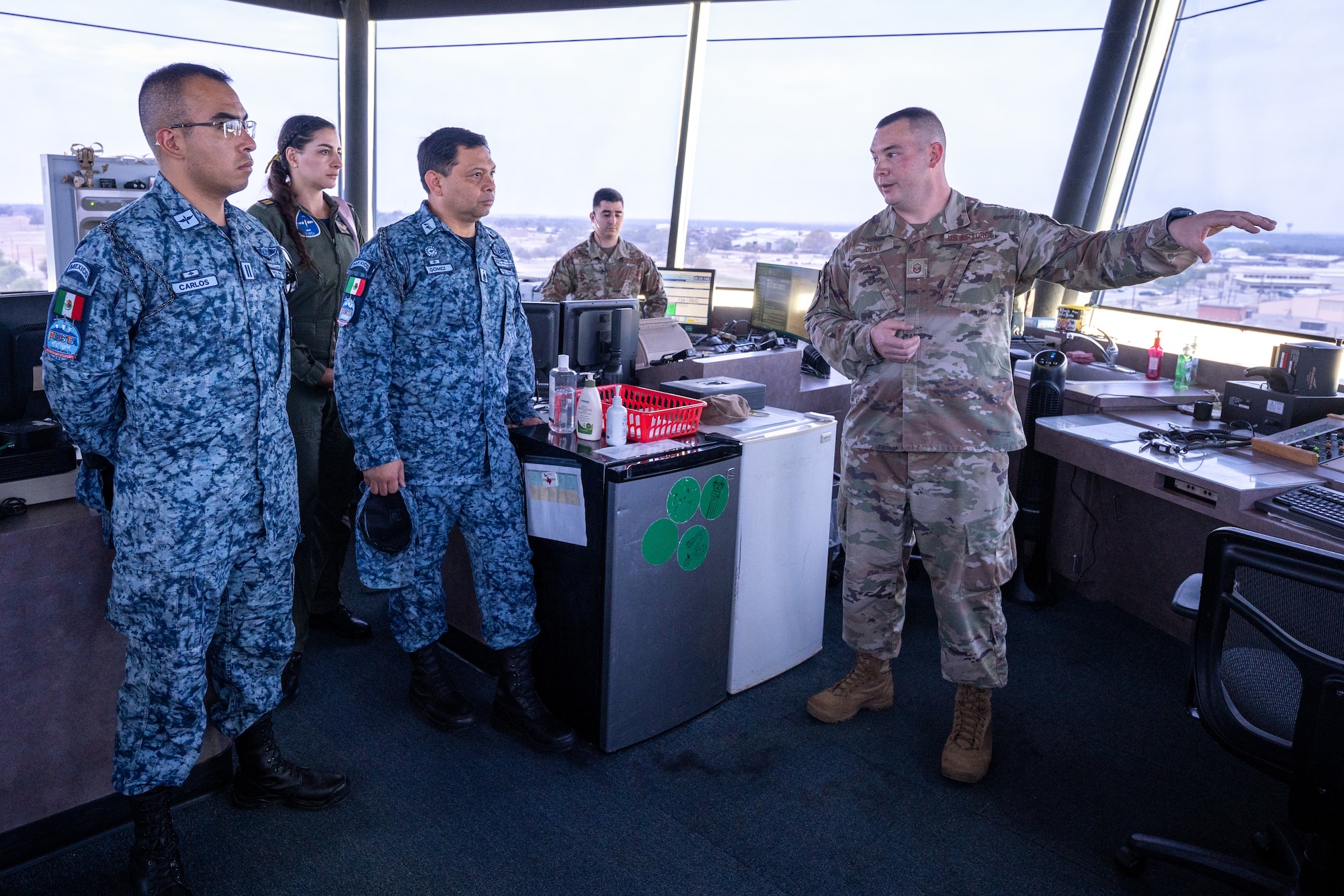 The Mexican Air Force Airmen and Mexican Air Force Brig. Gen. Disraeli Gomez Herrara, president of the Feria Aeroespecial Mexico (FAMEX), or the Mexico Aerospace Fair, listen to a briefing in the air traffic control tower at Laughlin Air Force Base, Texas, March 7, 2024.