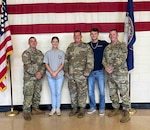 Spc. Ricky Wright, second from the right, poses with his twin sister, Faith; father, Sgt. 1st Class Brandon Wright; and his recruiters following his enlistment into the Virginia Army National Guard in June 2023. (Courtesy Photo)