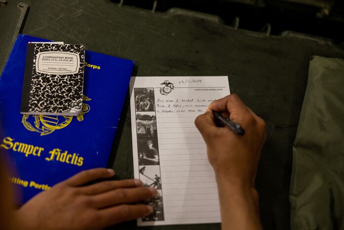 U.S. Marine Corps Recruit Robert Perez with Kilo Company, 3rd Recruit Training Battalion, writes a letter to his mother at Marine Corps Recruit Depot San Diego, California, March 11, 2024. Square away time gives recruits the opportunities to prepare uniforms and gear for the next day of training, reading mail, and writing letters.  (U.S. Marine Corps photo by Cpl. Joshua M. Dreher)