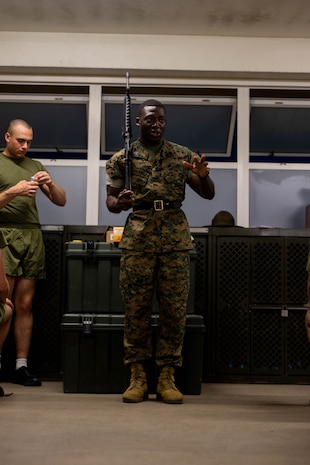 U.S. Marine Corps Staff Sgt. Stephen Falayi, a drill instructor with Kilo Company, 3rd Recruit Training Battalion, teaches his recruits close order drill during senior drill instructor time at Marine Corps Recruit Depot San Diego, California, March 11, 2024. SDI time is periodically scheduled to enable drill instructors the opportunity to address instructional remediation, core values reinforcement, mentorship, coaching and future training preparation. (U.S. Marine Corps photo by Cpl. Joshua M. Dreher)