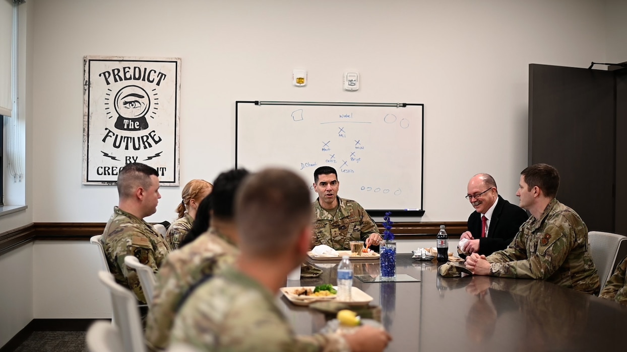 U.S. Air Force Maj. Gen. Matteo Martemucci, Deputy Chief, Central Security Service, National Security Agency, converses with 316th Training Squadron instructors and military training leaders as they eat lunch at the Cressman Dining Facility at Goodfellow Air Force Base, Texas Feb. 29, 2024. Maj. Gen. Martemucci spectated what Goodfellow is doing with their training and spoke on how to better prepare our future intelligence surveillance and reconnaissance warriors for challenges that may come their way. (U.S. Air Force photo by Airman 1st Class Brian Lummus)