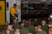 U.S. Marine Corps Sgt. Kevin Gonzalez, a drill instructor with Golf Company, 2nd Recruit Training Battalion, hands out mail to recruits at Marine Corps Recruit Depot San Diego, California, Mar. 11, 2024. Letters are the only means of communication between recruits and their loved ones and often serve as the only source of information from the outside world. (U.S. Marine Corps photo by Sgt. Jesse K. Carter-Powell)